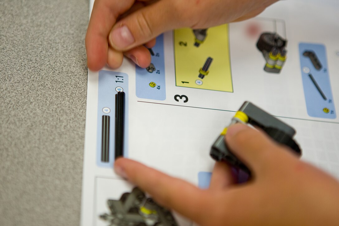 A student matches up a part of a Lego Mindstorms NXT robot kit during the Bitz Intermediate School Science Club May 1. Students are building robots, which will be programmed by a computer to obey their commands, with an end goal of being able to navigate a maze. The club was created by Pam Philpott and Travis Parker, teachers at the school, to deliver science in an entertaining and hands-on way to 12 fourth and fifth grade students.