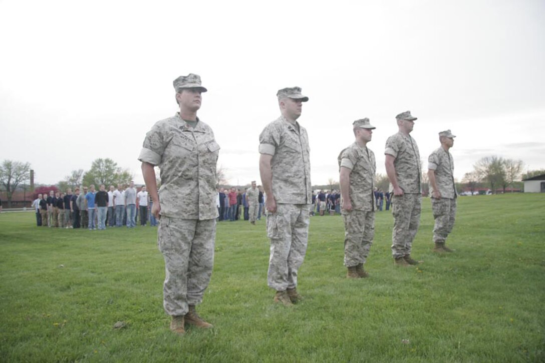 Marines receive awards in front of more than 400 poolees during the Recruiting Station Des Moines annual field meet May 1-2 here. The awards ceremony was an added portion to this year's annual field meet to show poolees what it's like to receive an award in a formation. (U.S. Marine Corps photo by Sgt. Bryan A. Peterson)