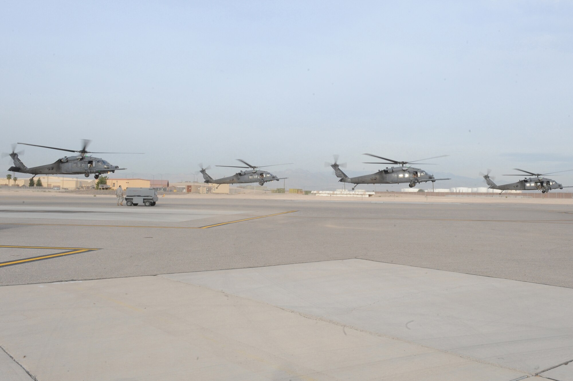 NELLIS AIR FORCE BASE, Nev.- Four HH-60G Pavehawk helicopters carrying approximately 24 Airmen from the 58th and 66th Rescue
Squadrons deploy for a real-world rescue mission May 1. The Airmen were requested by the Air Force Rescue Coordination Center to assist in the search for a pilot and passenger who were aboard a motorized sailplane that disappeared from radar in the Sierra Nevada Mountain Range near Mammoth Lakes, Calif., April. 24.  The aircraft was flying between Tonopah, Nev., and Modesto, Calif., and a search began about an hour after the plane was overdue.  As of April 30, the Civil Air Patrol and other agencies had flown more than 140 sorties in a 2,500 square-mile search area. The Air Force Rescue Coordination Center requested the assistance of the Nellis-based aircraft May 1, and within an hour of arriving on scene, the search ended when an HH-60 aircrew spotted and positively identified the missing aircraft.  The 58th and 66th Rescue Squadrons are subordinate units of the 23rd Wing based at Moody Air Force Base, Ga.
(U.S. Air Force photo by/Senior Airman Nadine Y. Barclay/RELEASED)
