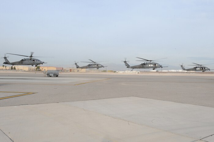 NELLIS AIR FORCE BASE, Nev.- Four HH-60G Pavehawk helicopters carrying approximately 24 Airmen from the 58th and 66th RescueSquadrons deploy for a real-world rescue mission May 1. The Airmen were requested by the Air Force Rescue Coordination Center to assist in the search for a pilot and passenger who were aboard a motorized sailplane that disappeared from radar in the Sierra Nevada Mountain Range near Mammoth Lakes, Calif., April. 24.  The aircraft was flying between Tonopah, Nev., and Modesto, Calif., and a search began about an hour after the plane was overdue.  As of April 30, the Civil Air Patrol and other agencies had flown more than 140 sorties in a 2,500 square-mile search area. The Air Force Rescue Coordination Center requested the assistance of the Nellis-based aircraft May 1, and within an hour of arriving on scene, the search ended when an HH-60 aircrew spotted and positively identified the missing aircraft.  The 58th and 66th Rescue Squadrons are subordinate units of the 23rd Wing based at Moody Air Force Base, Ga.(U.S. Air Force photo by/Senior Airman Nadine Y. Barclay/RELEASED)