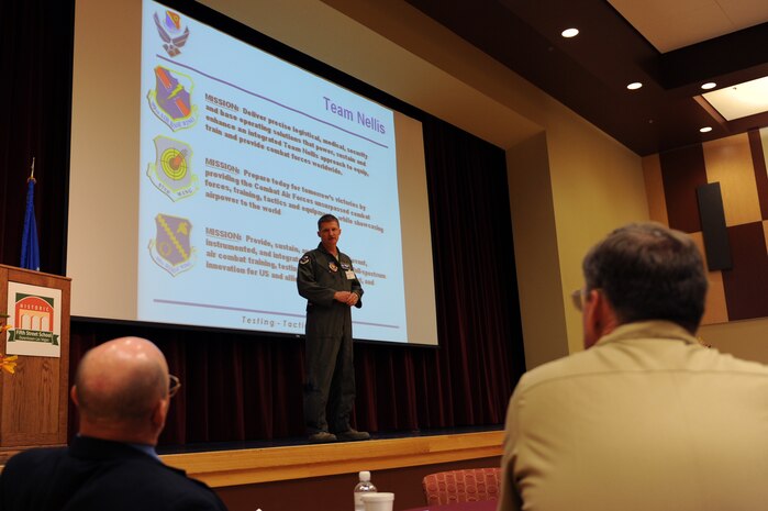 Col. Dave Belote, 99th Air Base Wing commander, addresses renewable energy industry leaders about the Team Nellis mission during the Nellis AFB Energy Summit, April 28. The summit was held to expand the dialogue between Department of Defense officials and wind and solar industry leaders in an effort to find synergistic solutions for renewable energy development. (U.S. Air Force photo by Airman 1st Class Brett Clashman)