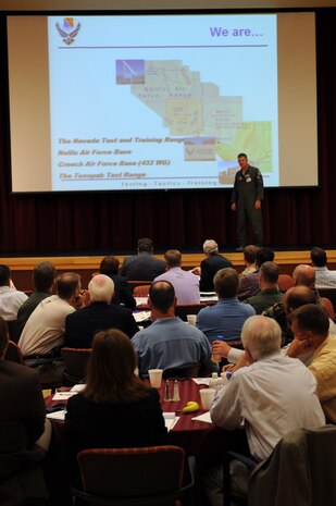 Col. Dave Belote, 99th Air Base Wing commander, addresses renewable energy industry leaders about the Team Nellis mission during the Nellis AFB Energy Summit, April 28. The summit was held to expand the dialogue between Department of Defense officials and wind and solar industry leaders in an effort to find synergistic solutions for renewable energy development. (U.S. Air Force photo by Airman 1st Class Brett Clashman)