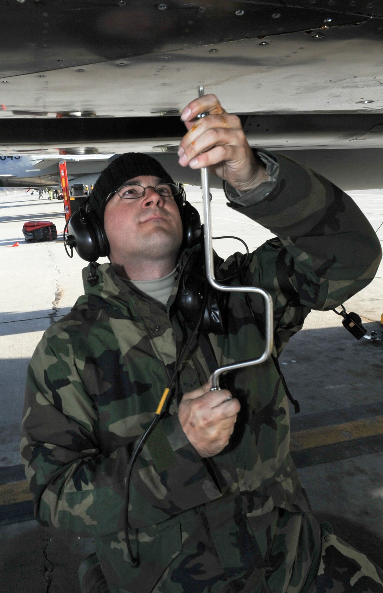 Airman 1st Class Gabriel Doering completes maintenance on an F-15 Eagle April 28 at Elmendorf Air Force Base, Alaska, prior to its flight during Red Flag-Alaska.  The exercise enables flying squadrons to enhance their warfighting capabilities by flying simulated combat sorties in a realistic threat environment.  Airman Doering is with the 2nd Aircraft Maintenance Unit at Tyndall AFB, Fla. (U.S. Air Force photo/Senior Airman Mathew Owens) 