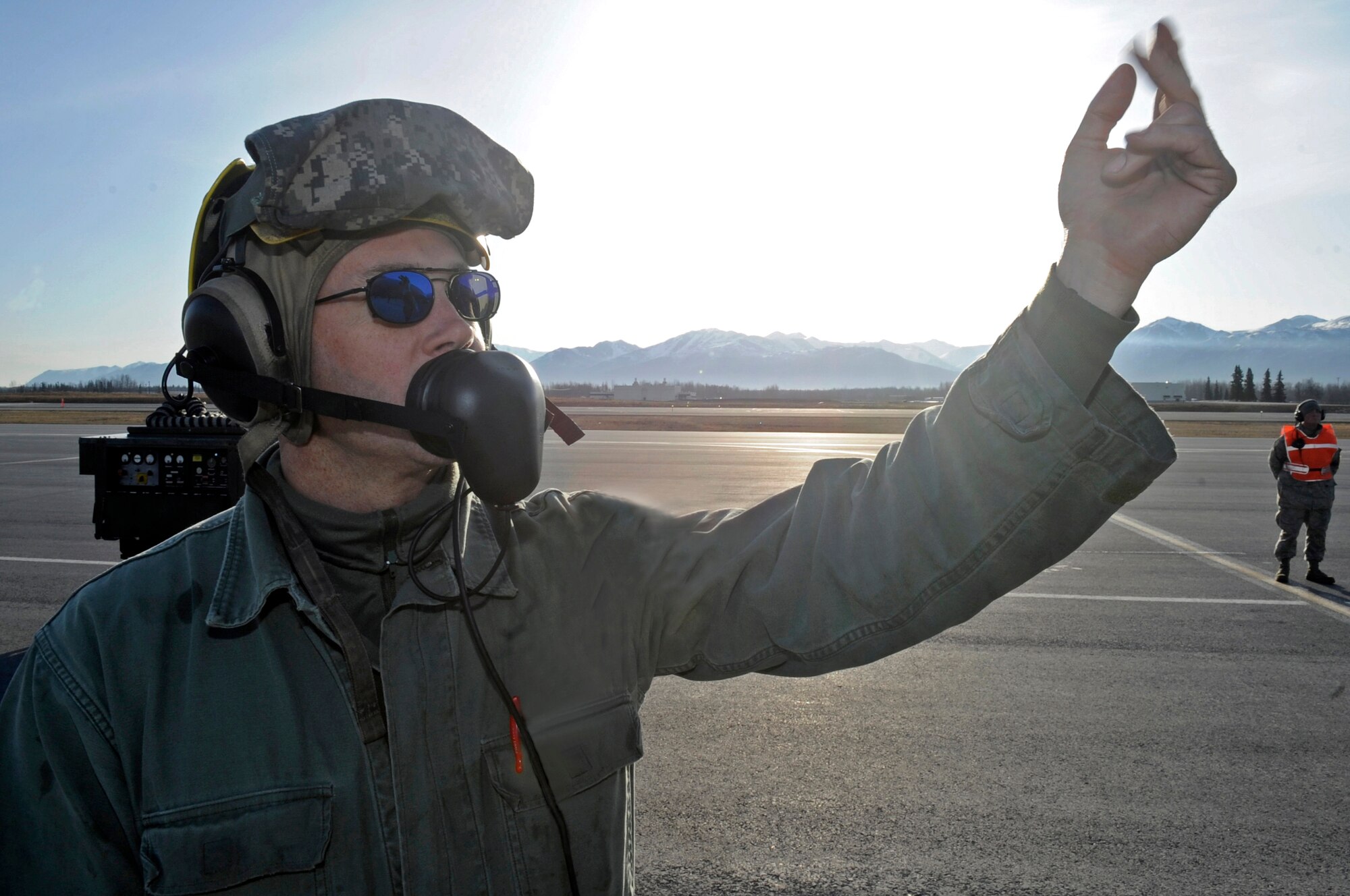 Tech. Sgt. Reginald Wagle, a crew chief with the 2nd Fighter Squadron at Tyndall Air Force Base, Fla., signals the pilot of his jet to begin taxiing for take off during Red Flag-Alaska April 28 at Elmendorf AFB, Alaska. This exercise enables flying squadrons to enhance their warfighting capabilities by flying simulated combat sorties in a realistic threat environment. (US Air Force photo/Senior Airman Mathew Owens) 