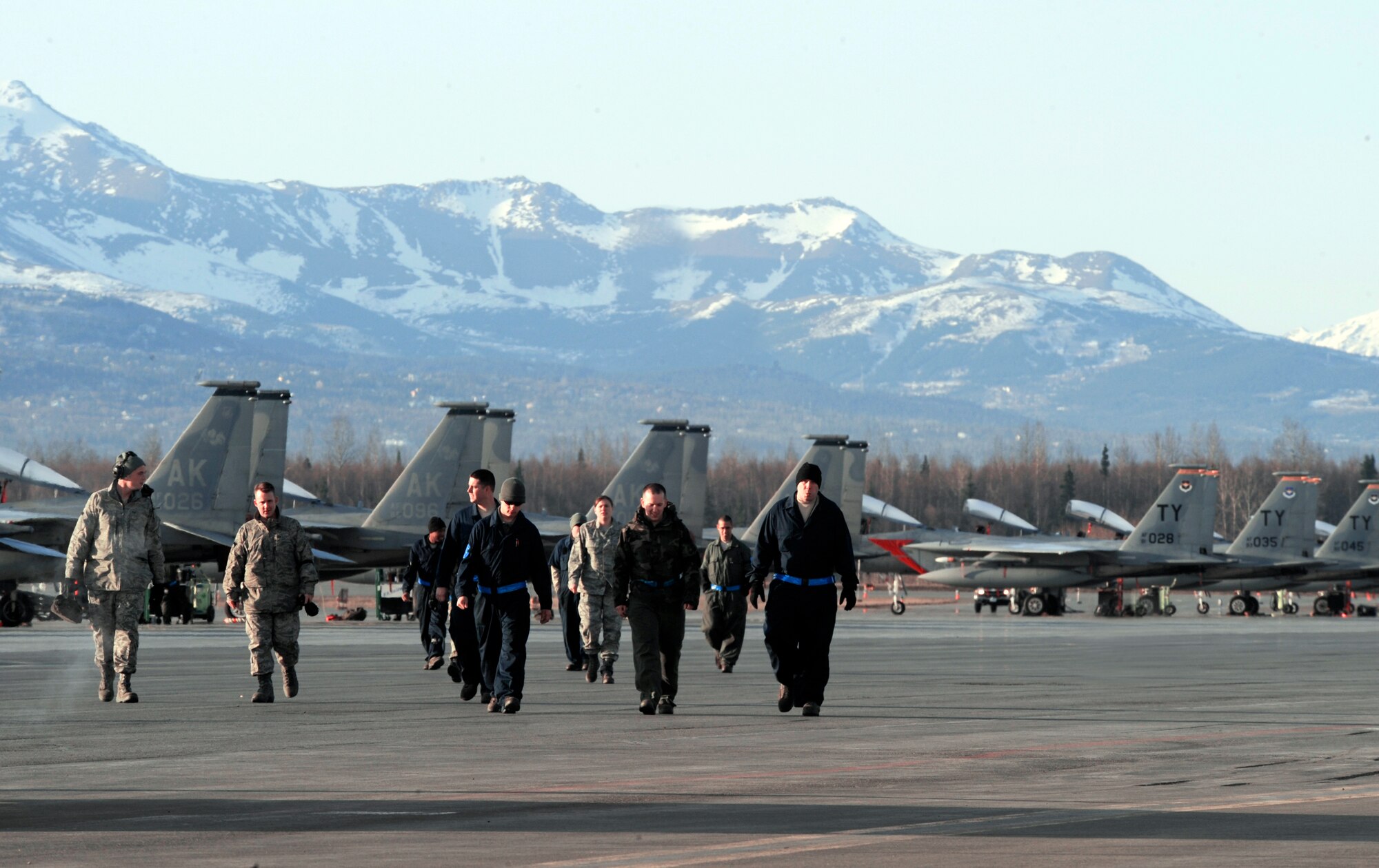 Airmen from the 19th Aircraft Maintenance Unit and the 2nd Aircraft Maintenance Unit at Tyndall Air Force Base, Fla., head to a hangar after preparing F-15 Eagles for takeoff during Red Flag-Alaska April 28 at Elmendorf AFB, Alaska. The exercise enables flying squadrons to enhance their warfighting capabilities by flying simulated combat sorties in a realistic threat environment. (U.S. Air Force photo/Senior Airman Matthew Owens) 