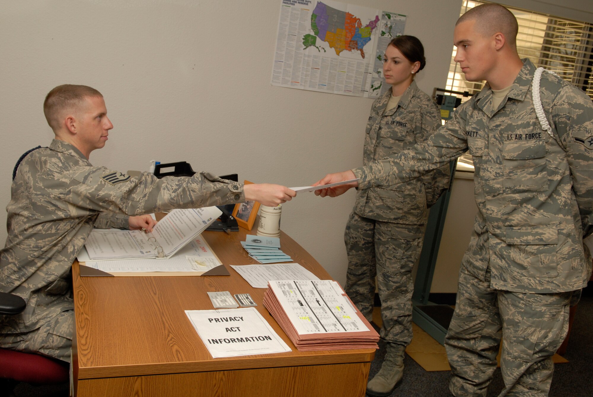 VANDENBERG AIR FORCE BASE, Calif. -- Taking time to mentor his Airmen, Staff Sgt. Ryan Cushing, a 381st Training Support Squadron military training leader, speaks with Airman Dustin Tackett and Airman Basic Christina Xenos, 533rd Training Squadron students, about the recruiter assistance program May 1. MTL's counsel, mentor and train non-prior service technical training Airmen to adapt to military life at their next duty station. (U.S. Air Force photo/Senior Airman Christian Thomas)