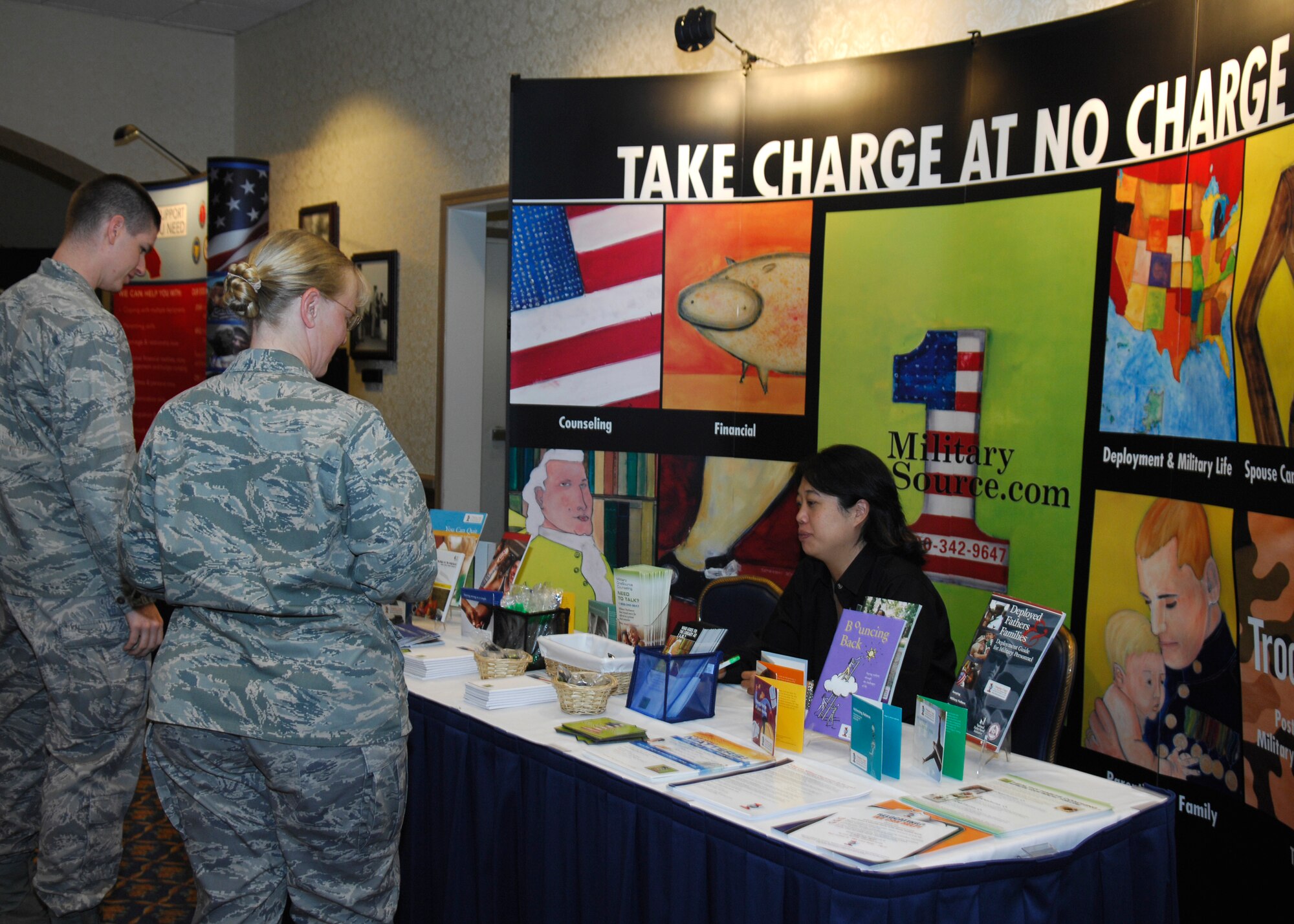 VANDENBERG AIR FORCE BASE, Calif. --  Members of Team V take a moment to learn the benefits of Military One Source during the Financial Readiness Roadshow May 1 at the Pacific Coast Club here. Many booths and workshops were available to help guide Airmen toward a path of financial success. (U.S. Air Force photo/Airman 1st Class Heather Shaw)