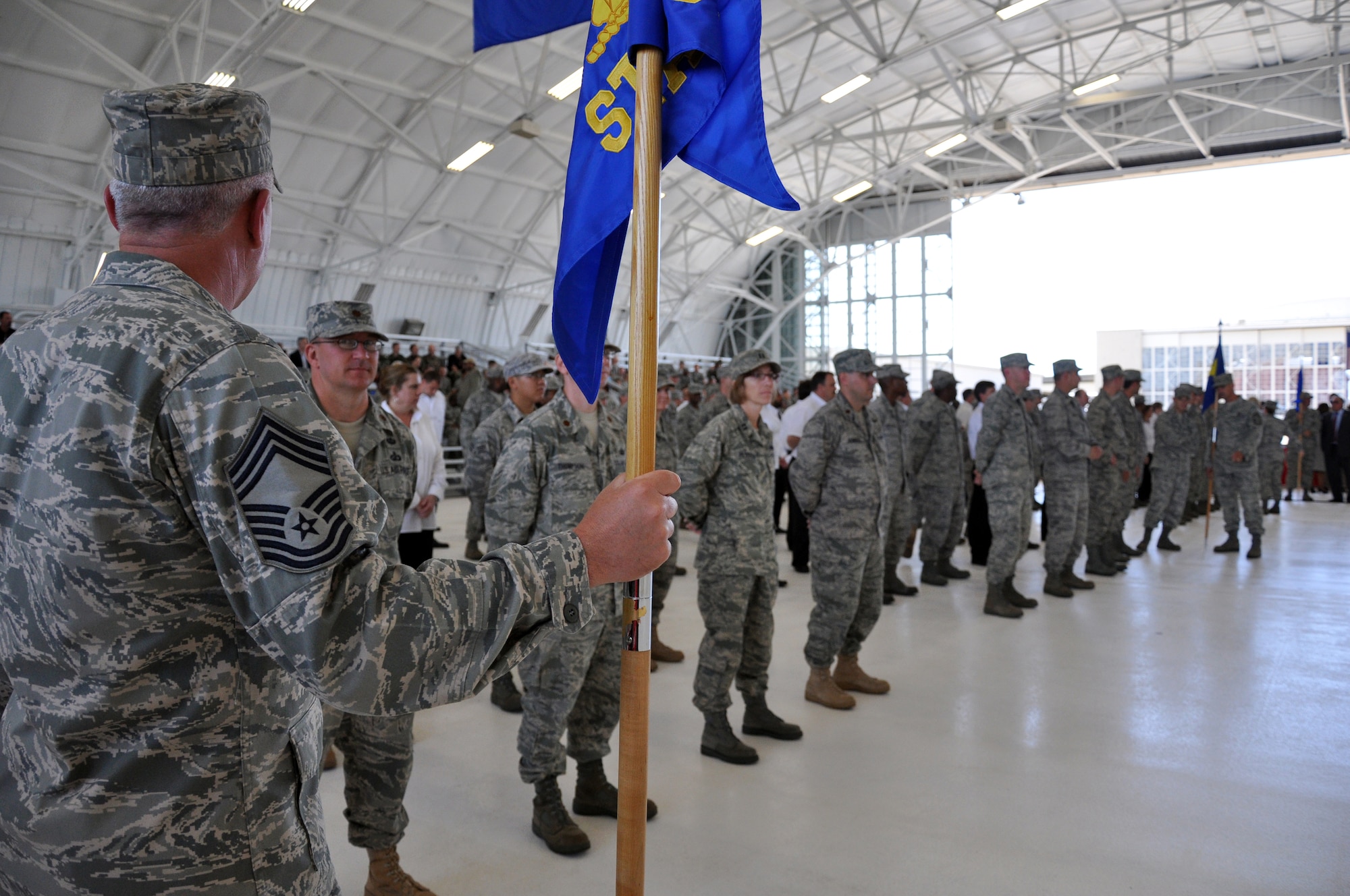 EGLIN AIR FORCE BASE, Fla. -- Chief Master Sgt. Christopher McCollor, 96th Mission Support Group command chief, holds the 96th Air Base Wing guide-on during the Air Armament Center change-of-command ceremony May 1. Maj. Gen. Charles R. Davis took command of the Air Armament Center from Maj. Gen. David Eidsaune during the ceremony. The change-of-command ceremony is a time-honored military tradition symbolizing the continuity of authority as command is passed from one individual to another. (U.S. Air Force photo/ Airman Anthony Jennings)