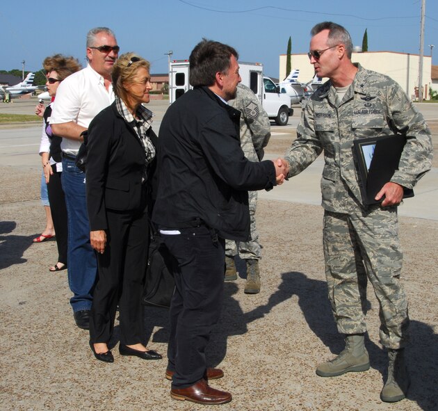 (Right) Brig. Gen. Darryl Roberson, 325th Fighter Wing commander, bids farewell to the 18 German civic leaders who took part in the U.S. Air Forces in Europe Civic Outreach Tour which stopped by Tyndall Air Force Base, Fla., April 29 and 30. Those on the tour not only learned about the many facets of the wing's mission, but were also given the chance to sit in the cockpit of an F-22 Raptor. The groups departure from Tyndall took them next to Charleston Air Force Base, S.C. (U.S. Air Force photo/Lisa Norman) 