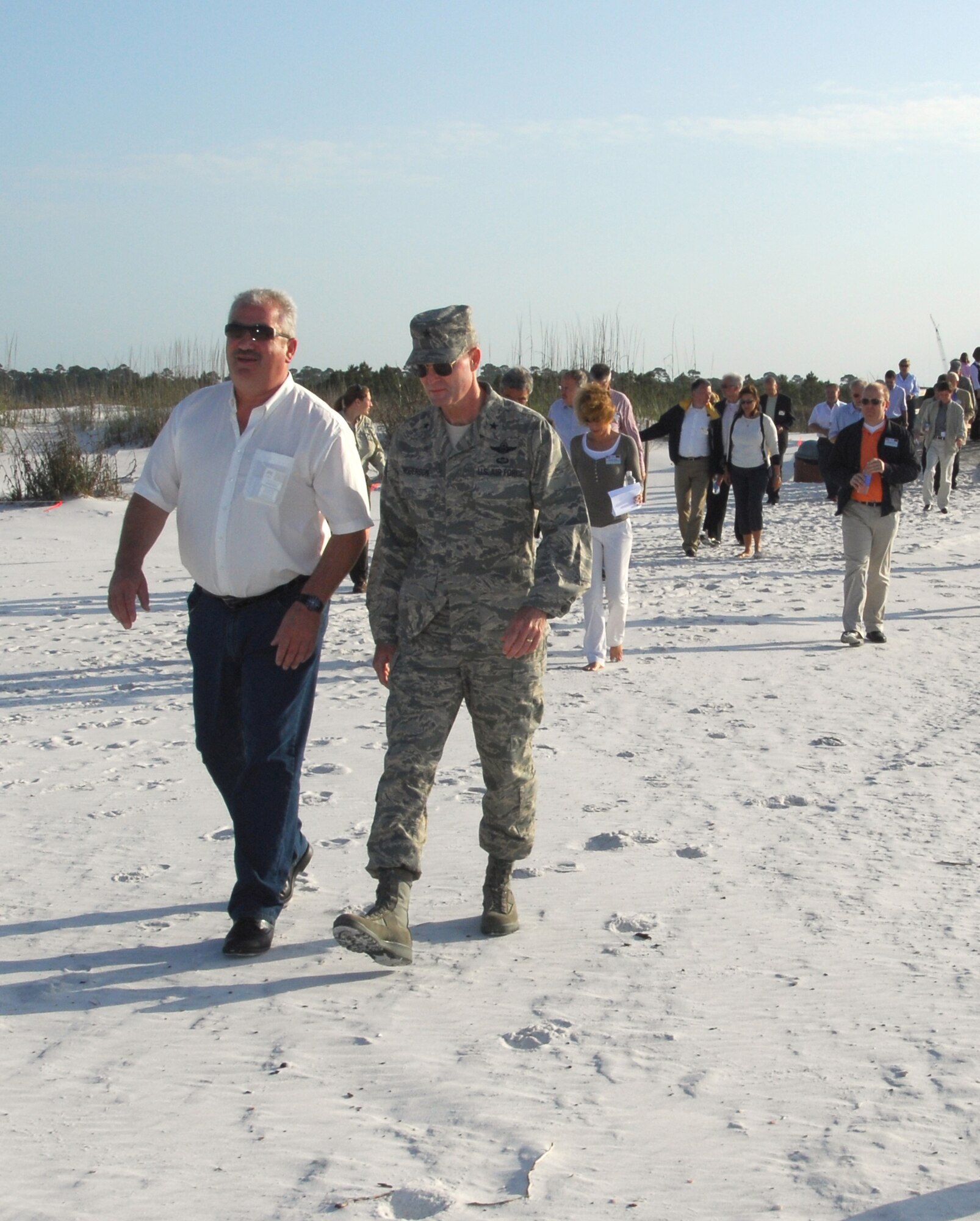 (Left) Michael Billen, member of the Rheinland-Pfalz State Parliament in Germany, walks with Brig. Gen. Darryl Roberson, 325th Fighter Wing commander, as they lead the other members of the mayor's group on a tour of the Tyndall Air Force Base, Fla., beach eco-system April 30. The German civic leaders were at Tyndall as one of their stops on the U.S. Air Forces in Europe Civic Outreach Tour.  The previous day, tour members visited some of the many units of Tyndall: the home of Air Dominance training for America. (U.S. Air Force photo/Lisa Norman) 
