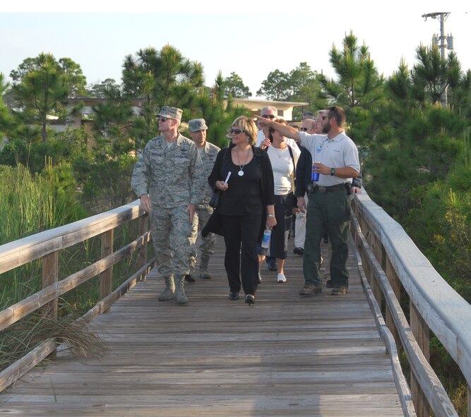 In the early hours of April 30, Brig. Gen. Darryl Roberts, 325th Fighter Wing commander, leads the 18 German civic leaders and other tour members of the U.S. Air Forces in Europe Civic Outreach Tour down the Tyndall Air Force Base, Fla., beach boardwalk as they make their way toward the beach for an eco-system tour led by Tyndall Natural Resources. During the tour the group was exposed to a few examples of the 144 endangered species Tyndall plays host to. (U.S. Air Force photo/Lisa Norman) 