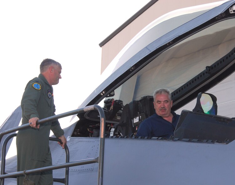 Col. William Mott V, 325th Operations Group commander, stands by as Michael Billen, member of the Rheinland-Pfalz State Parliament in Germany, gets the chance to sit in the cockpit of an F-22 Raptor April 29. The Raptor tours were part of the Tyndall Air Force Base, Fla., stop during the U.S. Air Forces in Europe Civic Outreach Tour. Earlier in the day the 18 German civic leaders who took part in the tour arrived at Tyndall after departing Scott Air Force Base, Ill. (U.S. Air Force photo/Lisa Norman) 