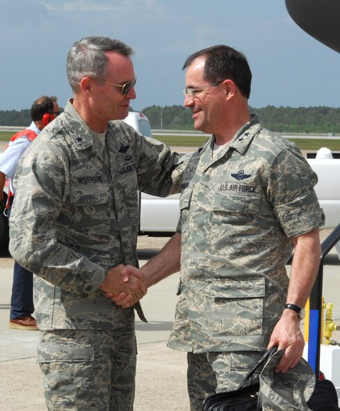 Brig. Gen. Darryl Roberson, 325th Fighter Wing commander, welcomes Maj. Gen. Marc Rogers, U.S. Air Forces in Europe vice commander, to Tyndall Air Force Base, Fla., April 29 after General Rogers arrived at Base Operations with members of the USAFE Civic Outreach Tour. Eighteen German civic leaders accompanied General Rogers. Through their stay, the tour members were exposed to some of the units which help make Tyndall the home of Air Dominance training for America. (U.S. Air Force photo/Lisa Norman) 