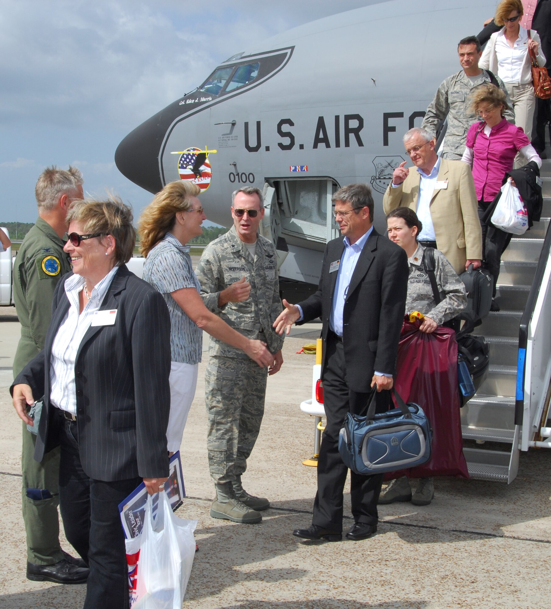 (Center) Brig. Gen. Darryl Roberson, 325th Fighter Wing commander, and his wife, Cheryl, greet German community leaders invited to be part of the U.S. Air Forces in Europe Civic Outreach Tour which stopped at Tyndall Air Force Base, Fla., April 29. During their stay, members of the group saw the F-22 Raptor up-close, received a mission brief from the 325th Air Control Squadron and took part in a guided Tyndall eco-system tour led by Natural Resources. The group departed Tyndall early in the morning April 30. (U.S. Air Force photo/Lisa Norman) 