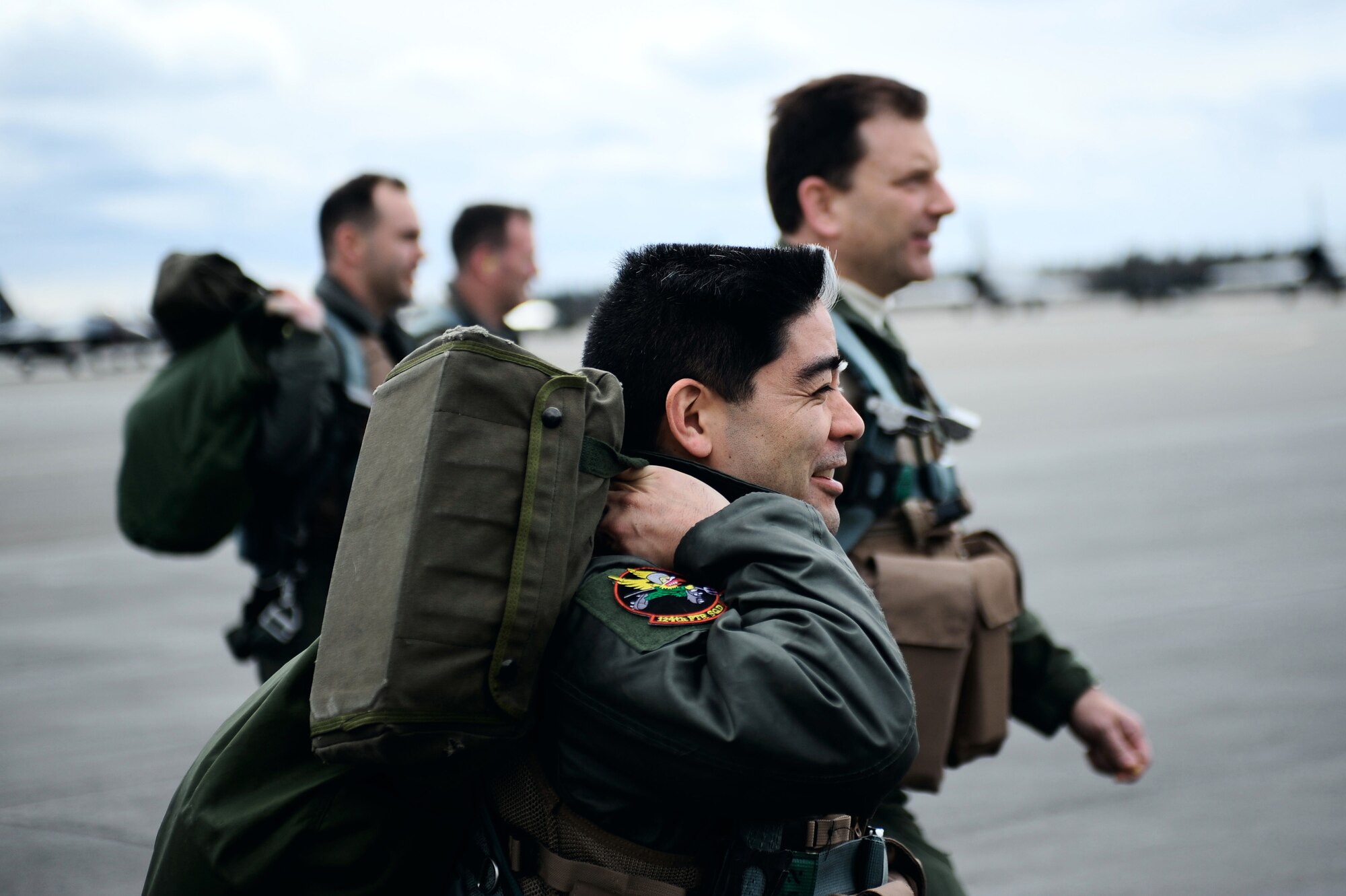 Pilots from the 124th Fighter Squadron at Des Moines, Iowa, walk to their F-16 Fighting Falcons during Red Flag-Alaska 09-2 April 24 at Eielson Air Force Base, Alaska. The exercise enables aviation units to sharpen their skills by flying ten simulated combat sorties in a realistic threat environment. (U.S. Air Force photo/Senior Airman Jonathan Snyder)