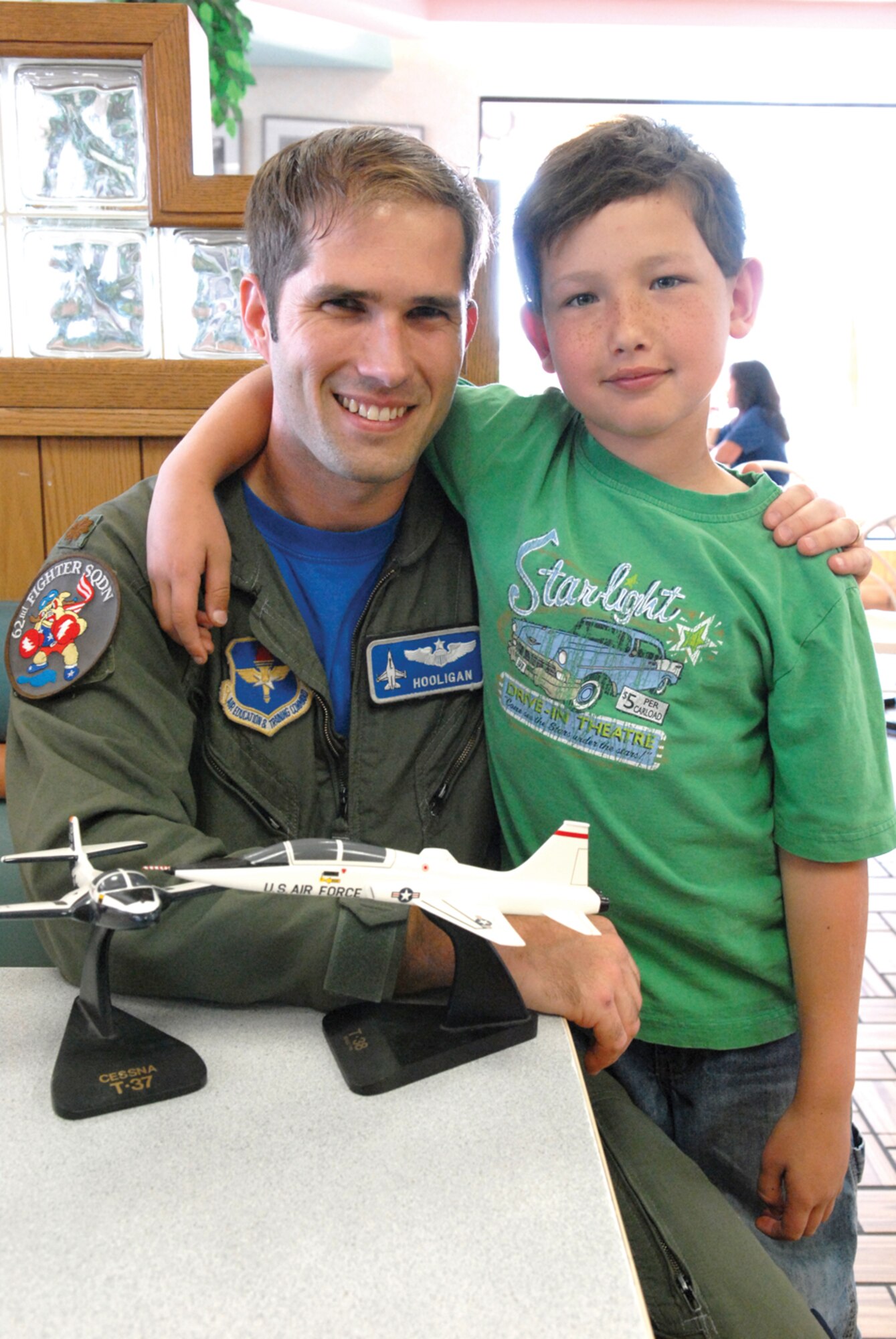 Maj. Sean Holahan, 62nd Fighter Squadron assistant director of operations, and Sean Simmons pose for a photo. (U.S. Air Force photo/ Deborah Silliman Wolfe.)