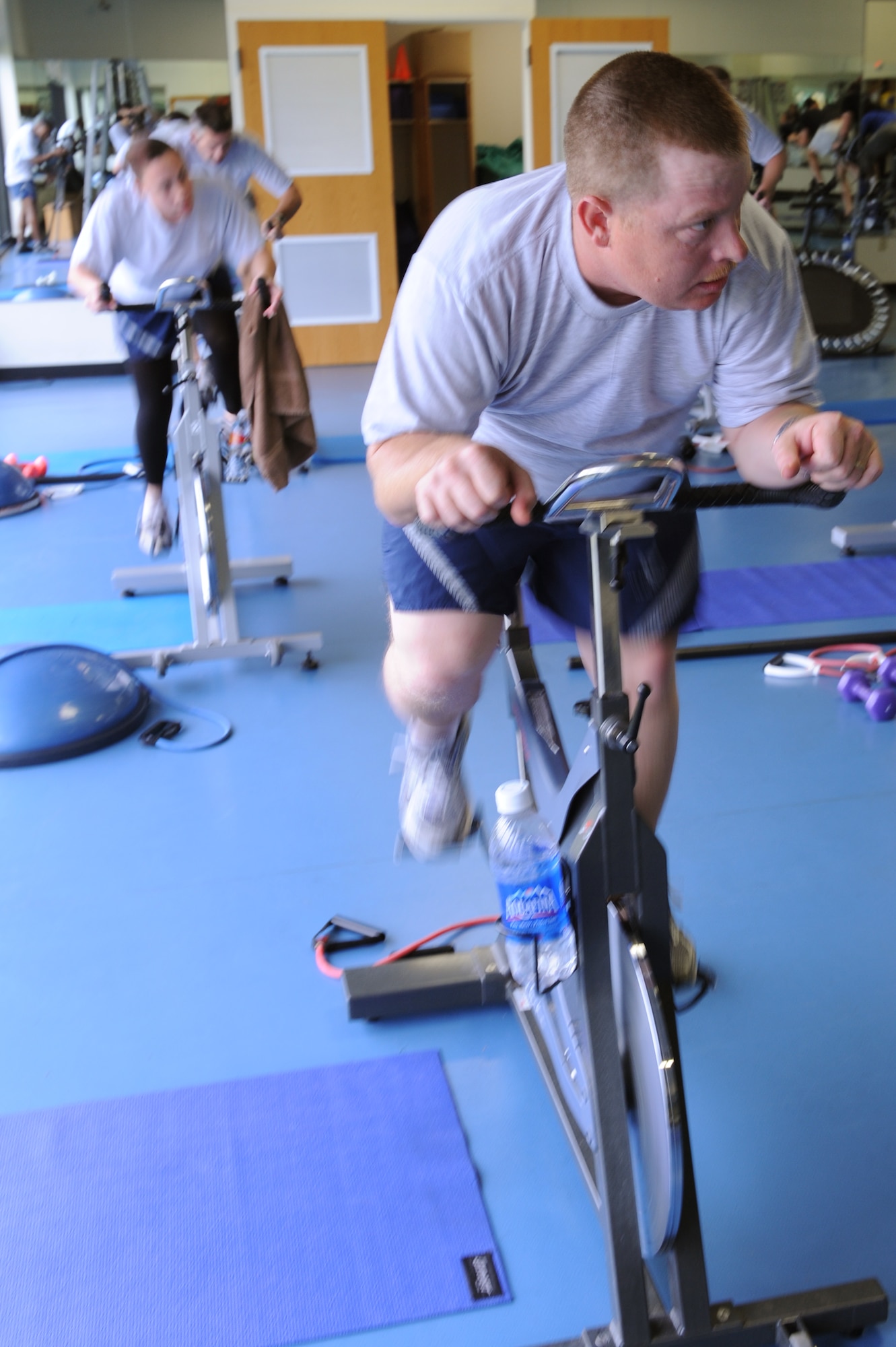 Tech. Sgt. Mark Hettinger, a 19th Aircraft Maintenance Squadron aircraft maintainer craftsman, pedals a spin bike during a burn hour session at the Fitness Center Monday.