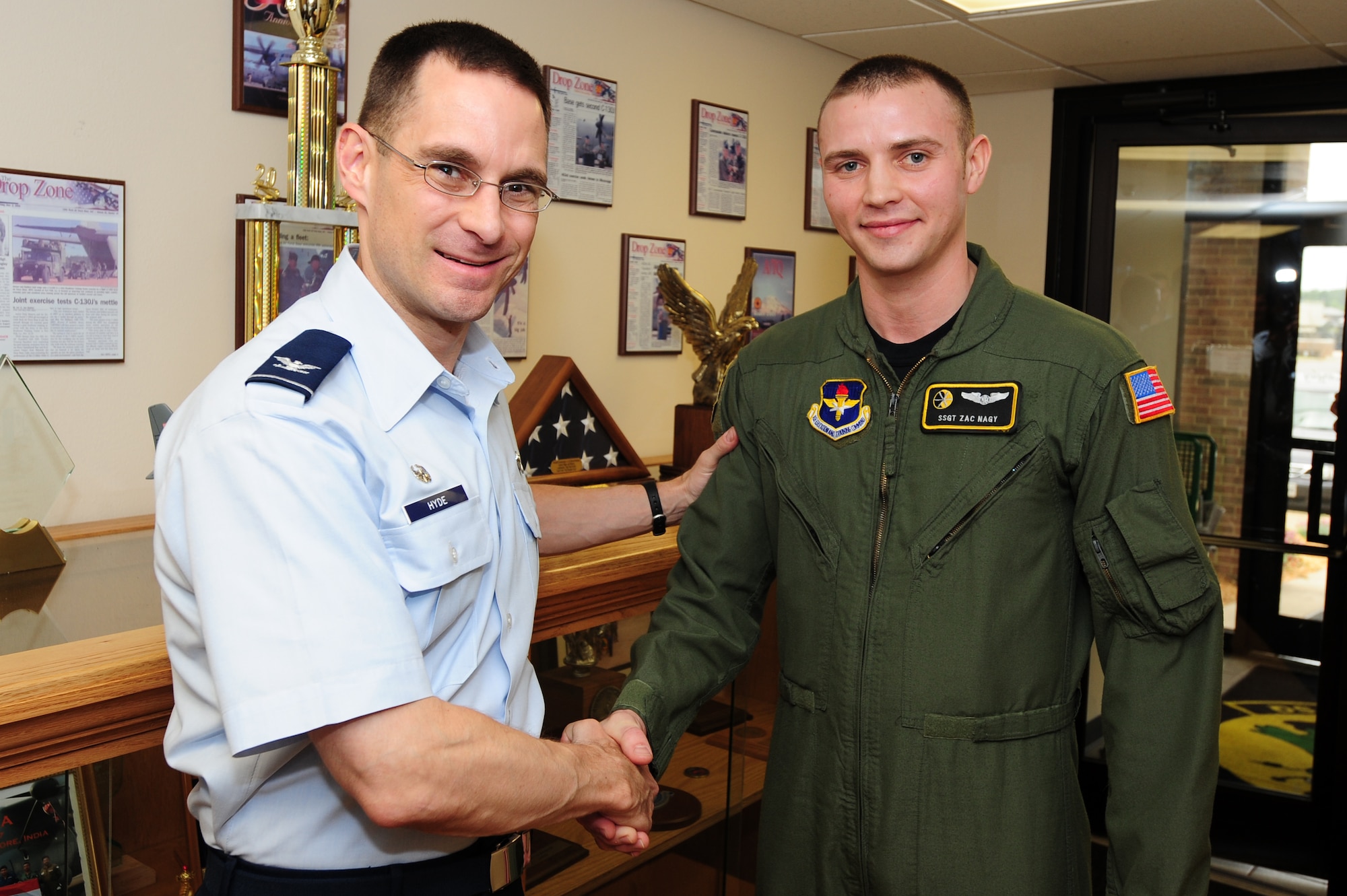 Col. C.K. Hyde, 314th Airlift Wing commander, presents Staff Sgt. Zach Nagy, a 48th Airlift Squadron loadmaster instructor and student evaluator, with a coin for his selection as the Combat Airlifter of the Week Monday. Sergeant Nagy is responsible for all the 48th AS’s assigned personnel’s annual ground and flying training events. Additionally, Sergeant Nagy tracked and validated annual ground and flight training for all assigned personnel ensuring a 100 percent completion rate of all annual currencies.