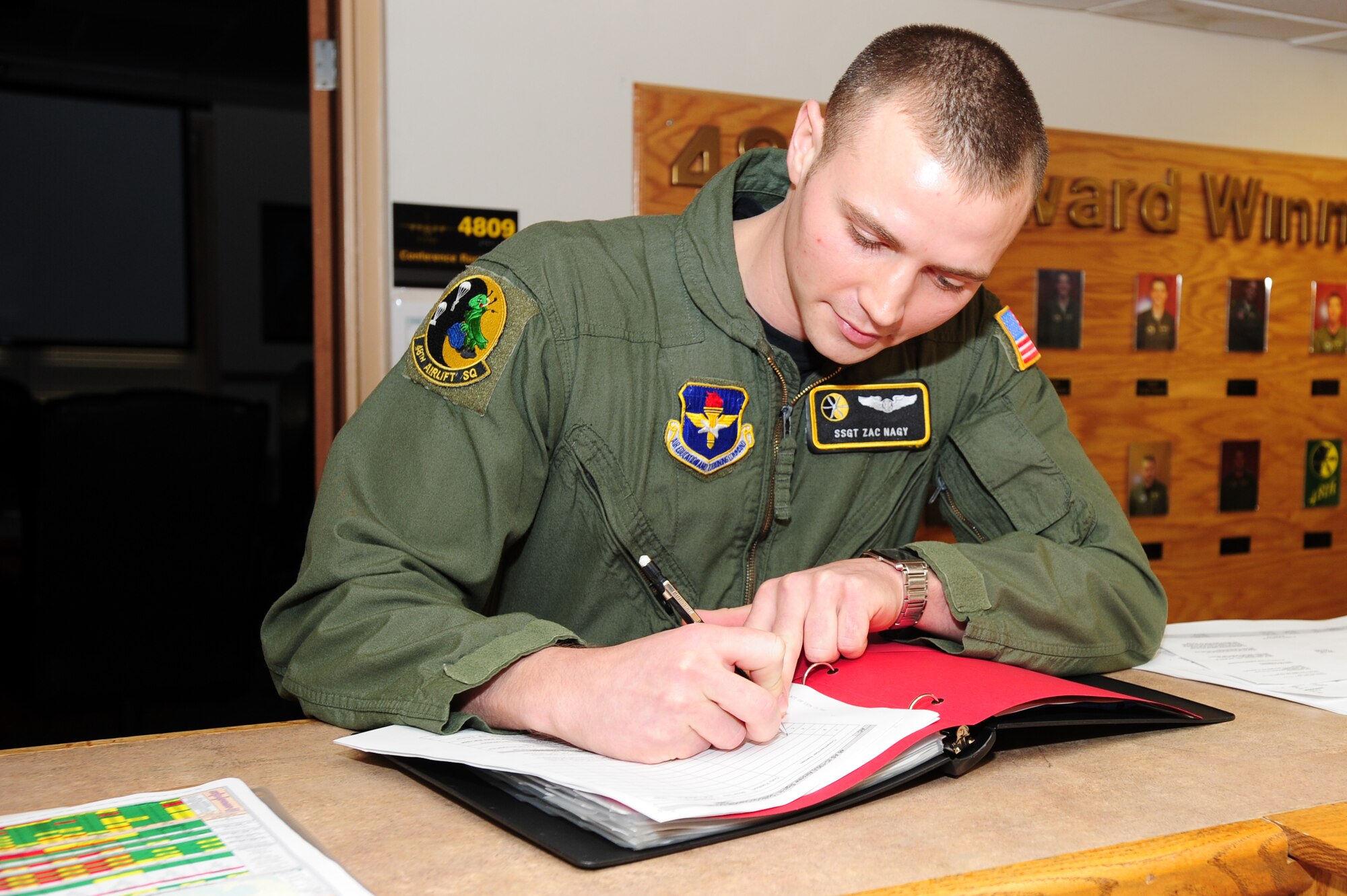 Col. C.K. Hyde, 314th Airlift Wing commander, presents Staff Sgt. Zach Nagy, a 48th Airlift Squadron loadmaster instructor and student evaluator, with a coin for his selection as the Combat Airlifter of the Week Monday. Sergeant Nagy is responsible for all the 48th AS’s assigned personnel’s annual ground and flying training events. Additionally, Sergeant Nagy tracked and validated annual ground and flight training for all assigned personnel ensuring a 100 percent completion rate of all annual currencies.