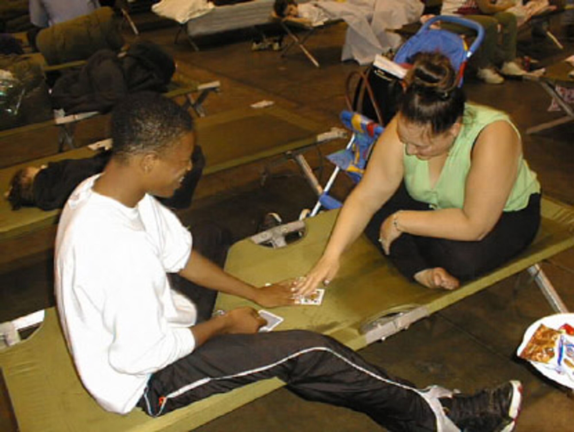 Storm survivors played games overnight in the 507th ARW hangar. (1999 file photo)