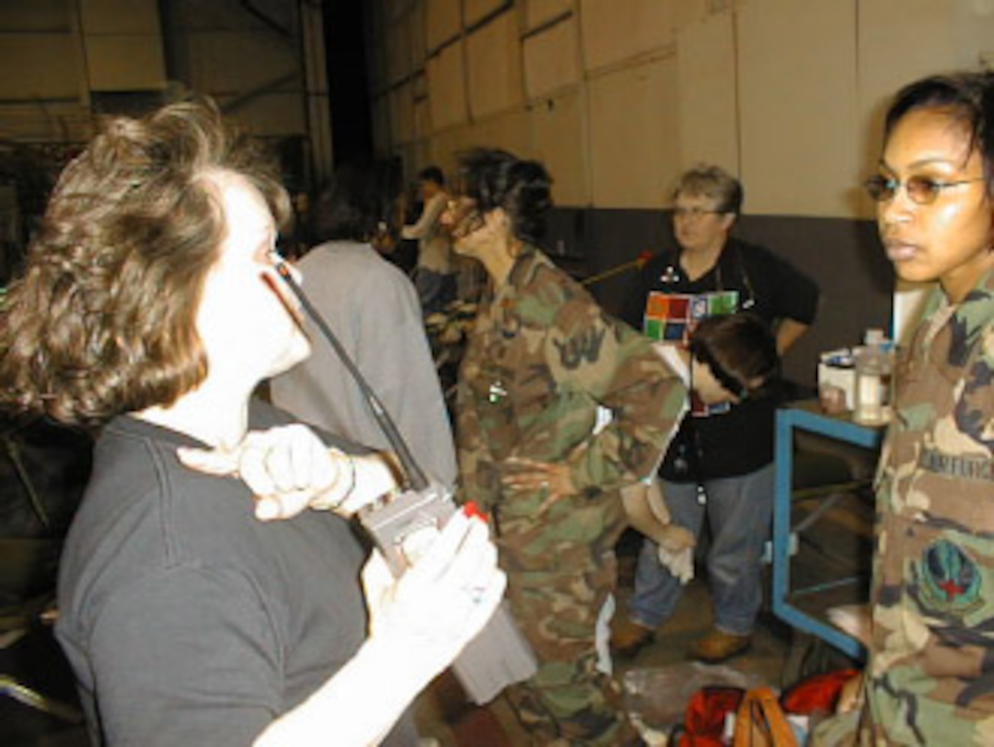 MSgt. Sheila Russell helps coordinate Air Force Reservists from the  507th Air Refueling Wing get the wing's hangar organized to receive area residents left homeless following the May 3, 1999 tornado.  More than 250 area residents spent several nights as guests of the wing until they could coordinate for other living arrangements. (1999 file photo)