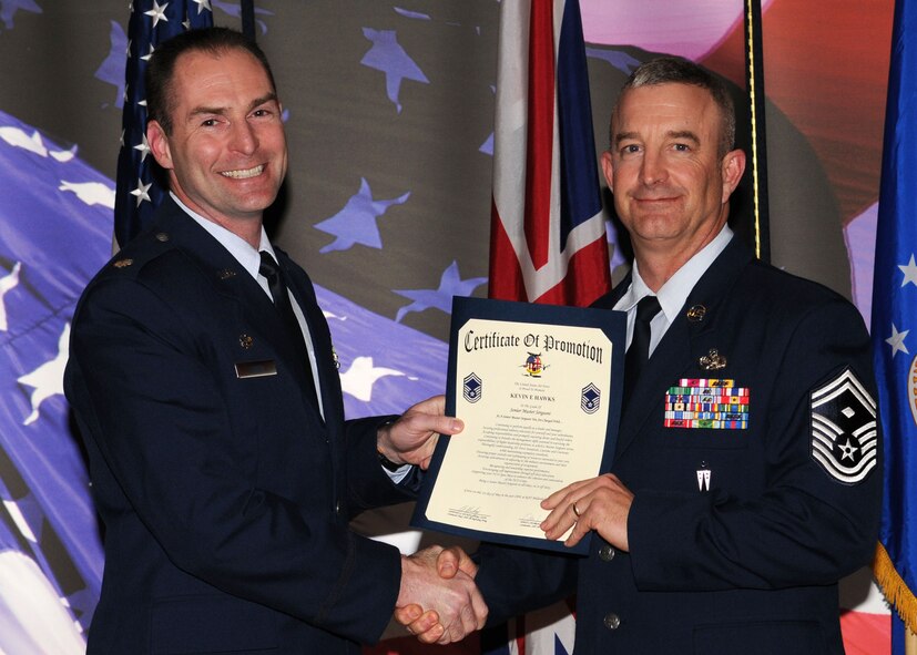 Master Sgt. Kevin E. Hawks is promoted to the rank of senior master sergeant by Lt. Col. Richard L. Smith, the 100th Logistics Readiness Squadron commander, during the promotion ceremony held at the Galaxy Club April 30, 2009, in RAF Mildenhall, England. (U.S. Air Force photo by Staff Sgt. Jerry Fleshman)