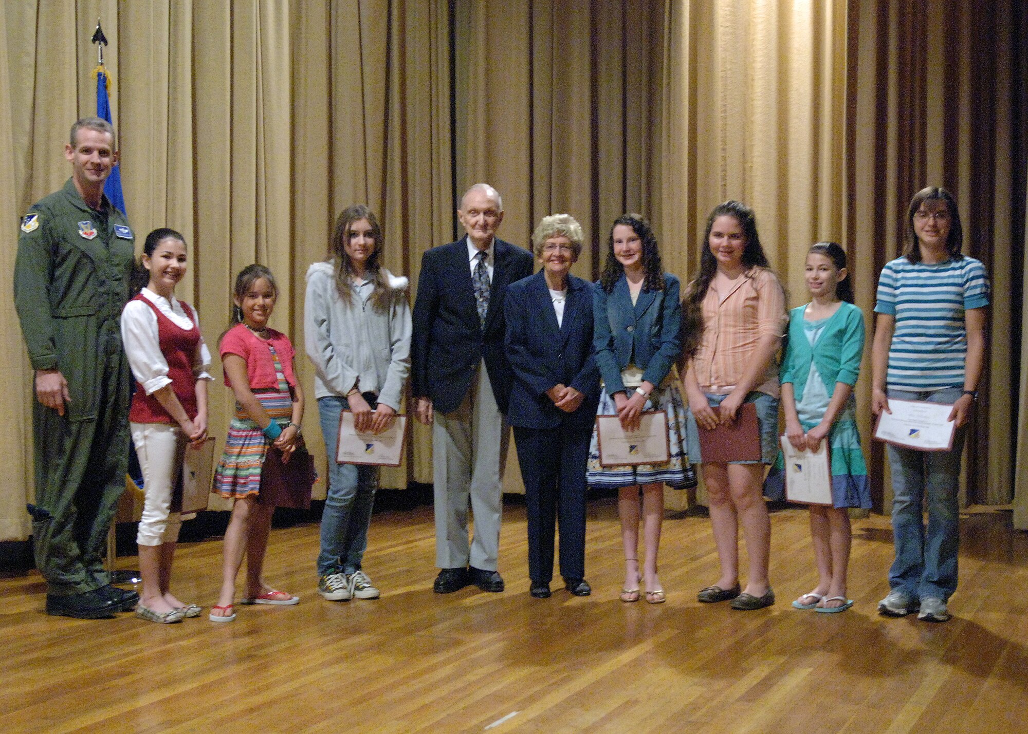 Students chosen from Holloman Middle School were awarded for their creative stories during the Holocaust ‘Days of Remembrance’ event at the base theatre on Holloman Air Force Base, N.M., April 21. Their stories were written to memorialize and educate the Airmen to remember the impact our actions have on other people. (U.S. Air Force photo/Airman 1st Class Veronica Stamps)