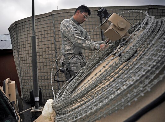 Staff Sgt. Nestor Sosa inspects a medium tactical vehicle after combat operations April 20 at Forward Operating Base Herrara, Afghanistan. Sergeant Sosa is a vehicle maintainer assigned to the Paktya Provincial Reconstruction Team from Forward Operating Base Gardez, Afghanistan. He is deployed from the 97th Logistics Readiness Squadron, Altus Air Force Base, Okla. (U.S. Air Force photo/Staff Sgt. Shawn Weismiller)