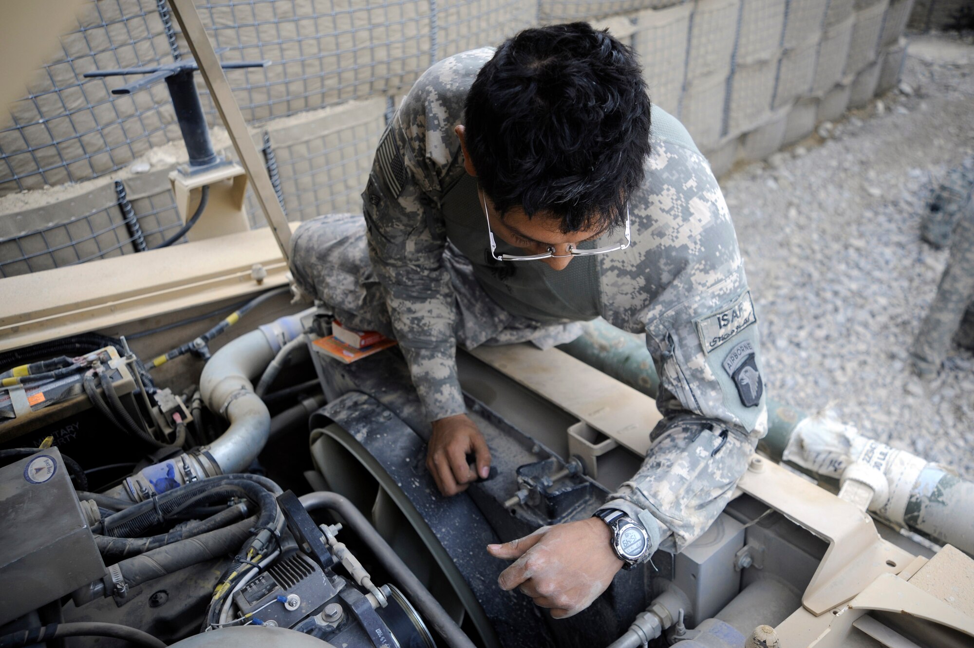 Staff Sgt. Nester Sosa inspects a medium tactical vehicle after combat operations April 20 Forward Operating Base Herrara, Afghanistan. Sergeant Sosa is a vehicle maintainer assigned to the Paktya Provincial Reconstruction Team from Forward Operating Base Gardez, Afghanistan. He is deployed from the 97th Logistics Readiness Squadron from Altus Air Base, Okla. (U.S. Air Force photo/Staff Sgt. Shawn Weismiller) 
