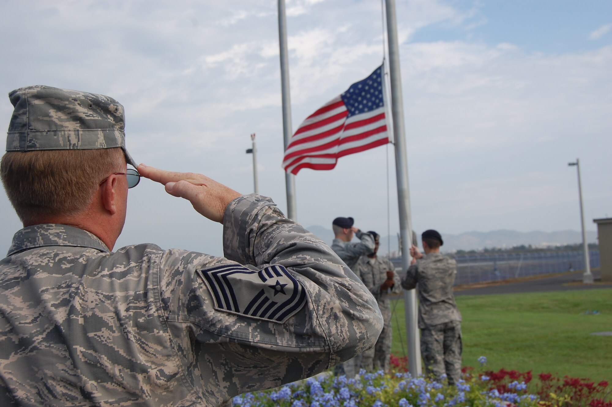 Chief Master Sgt. Kevin Van Gordon, 612th Theater Operations Group Superintendent, Davis-Monthan Air Force Base, Ariz., renders a salute at a FOL Manta formal retreat ceremony April 22. Chief Van Gordon accompanied the Air Forces Southen Command Chief Master Sgt., Chief Master Sgt. Lloyd Hollen, to visit FOL Airmen, see their mission, and hear from them firsthand. (U.S. Air Force photo by 1st Lt. Beth Woodward)