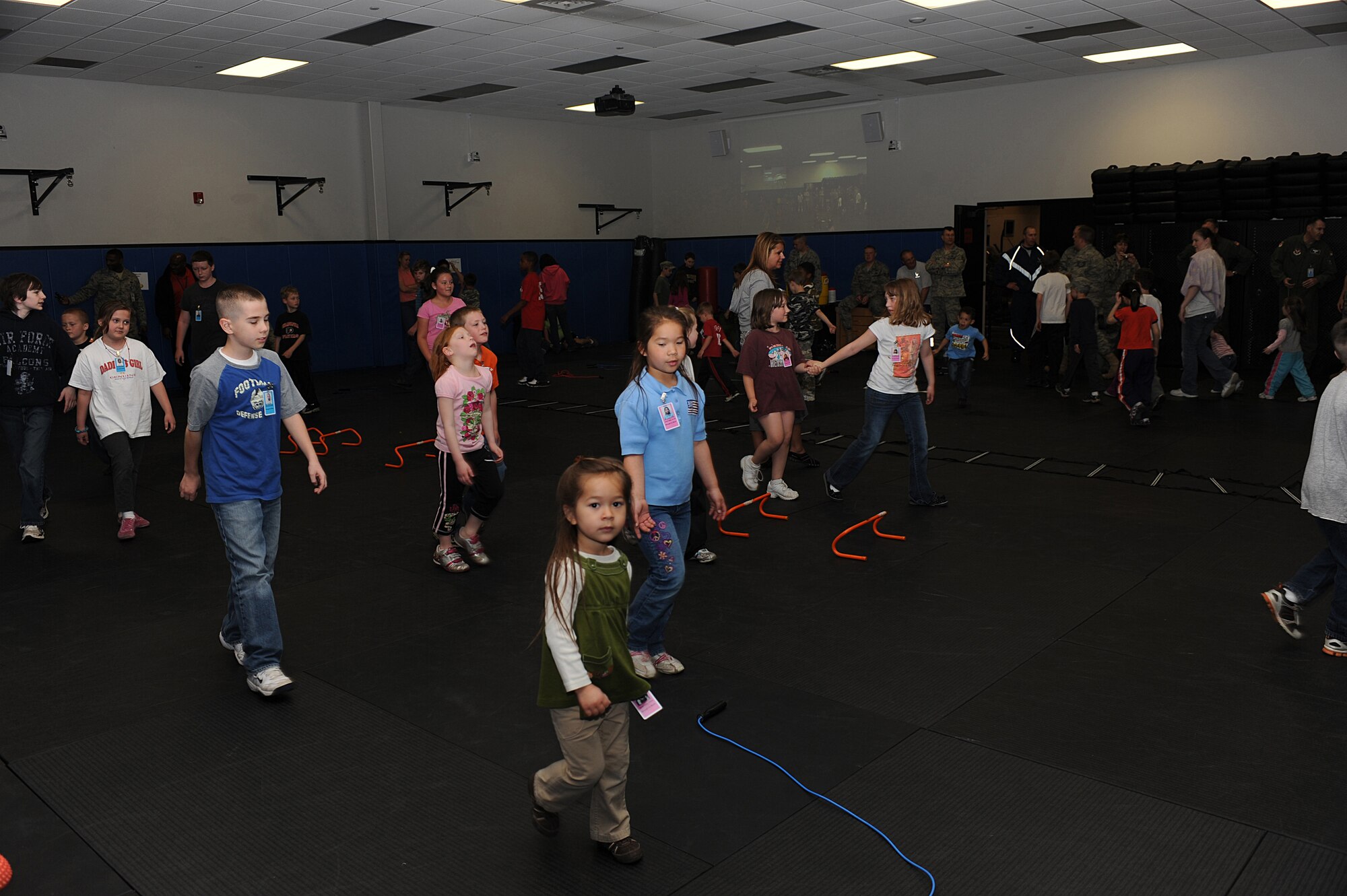Children participate in physical training April 23 as part of "Bring Your Child to Work Day" at the U.S. Air Force Expeditionary Center on Fort Dix, N.J.  The day included physical training, vehicle static display, a military working dog demo and explosive ordinance disposal demo.   (U.S. Air Force Photo/Staff Sgt. Nathan G. Bevier) 