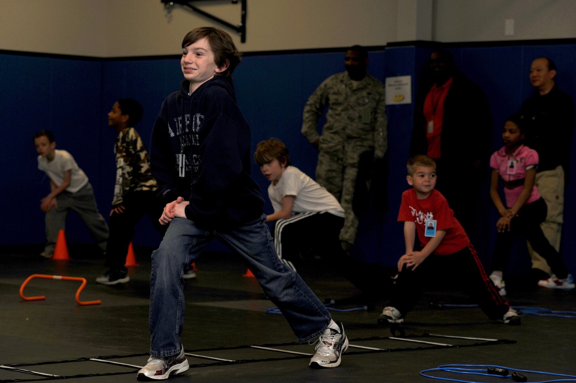 Children participate in physical training April 23 as part of "Bring Your Child to Work Day" at the U.S. Air Force Expeditionary Center on Fort Dix, N.J.  The day included physical training, vehicle static display, a military working dog demo and explosive ordinance disposal demo.   (U.S. Air Force Photo/Staff Sgt. Nathan G. Bevier) 