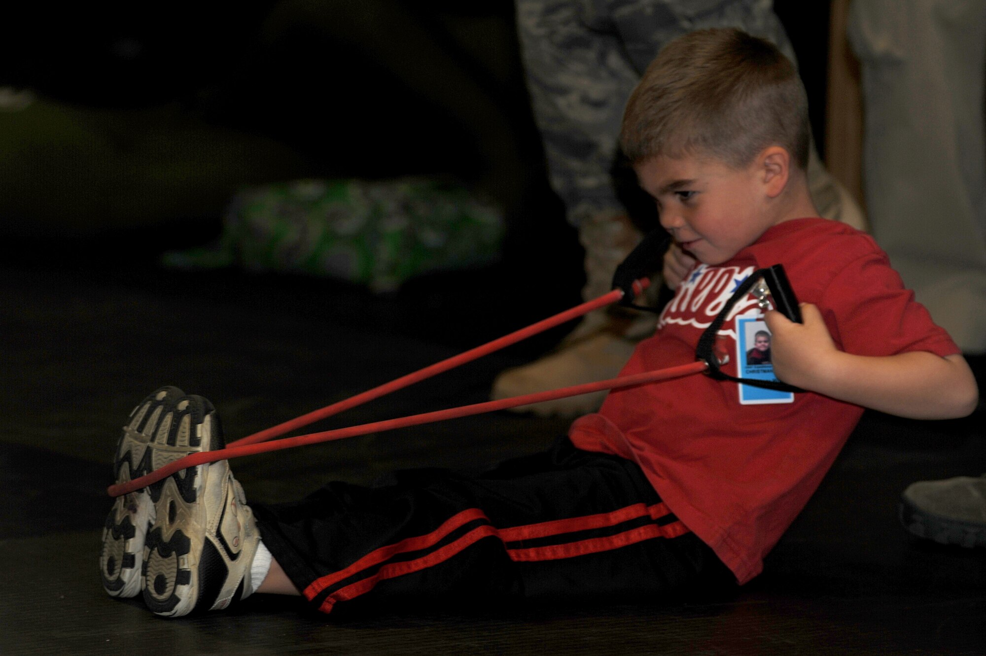 Jax, 4 year old son of Tech. Sgt. Zachary and Melissa Christman, participates in physical training exercises April 23 as part of "Bring Your Child to Work Day" at the U.S. Air Force Expeditionary Center on Fort Dix, N.J.  The day included physical training, vehicle static display, a military working dog demo and explosive ordinance disposal demo.   (U.S. Air Force Photo/Staff Sgt. Nathan G. Bevier) 