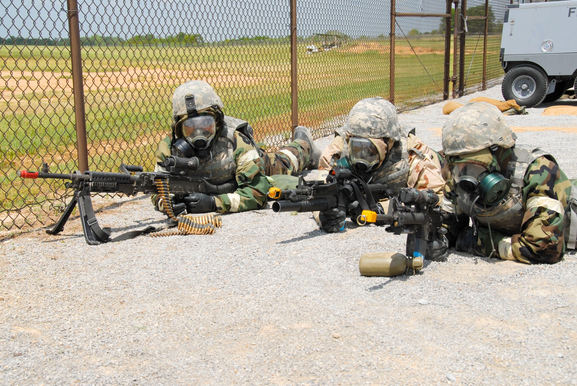 Members of the 908th Airlift Wing take up a defensive position along the Blue Thunder perimeter fence during the Patriot Thunder Operational Readiness Training Program exercise held April 23-30. The exercise was conducted in preparation for an up-coming Operational Readiness Inspection scheduled for December. (U.S. Air Force photo by Jamie Pitcher)