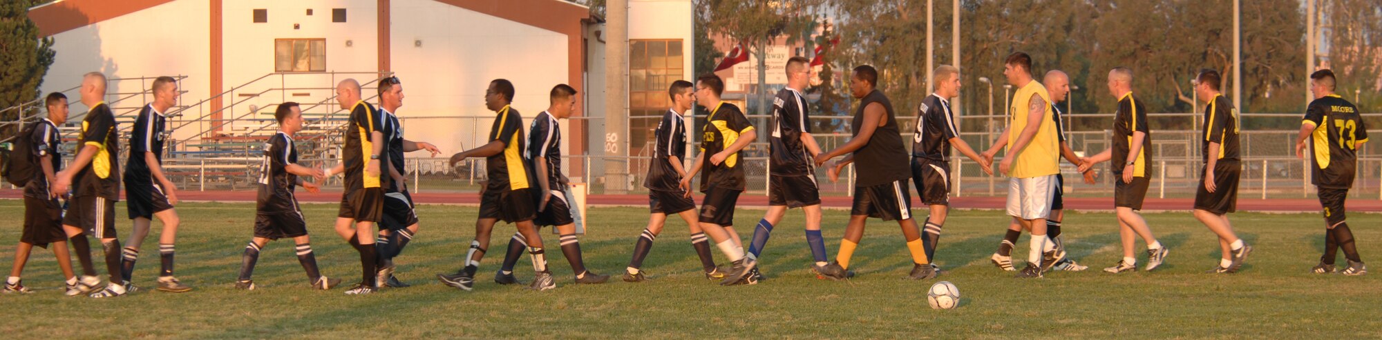 In a show of good sportsmanship members of the Maintenance Squadron team shake hands with the Communication Squadron team after the intramural soccer game at Incirlik Air Base, Turkey, April 28, 2009. The game resulted in a tie score of 2-2. The intramurals are made up of nine squadron teams. (U.S. Air Force photo/Staff Sgt. Lauren Padden)