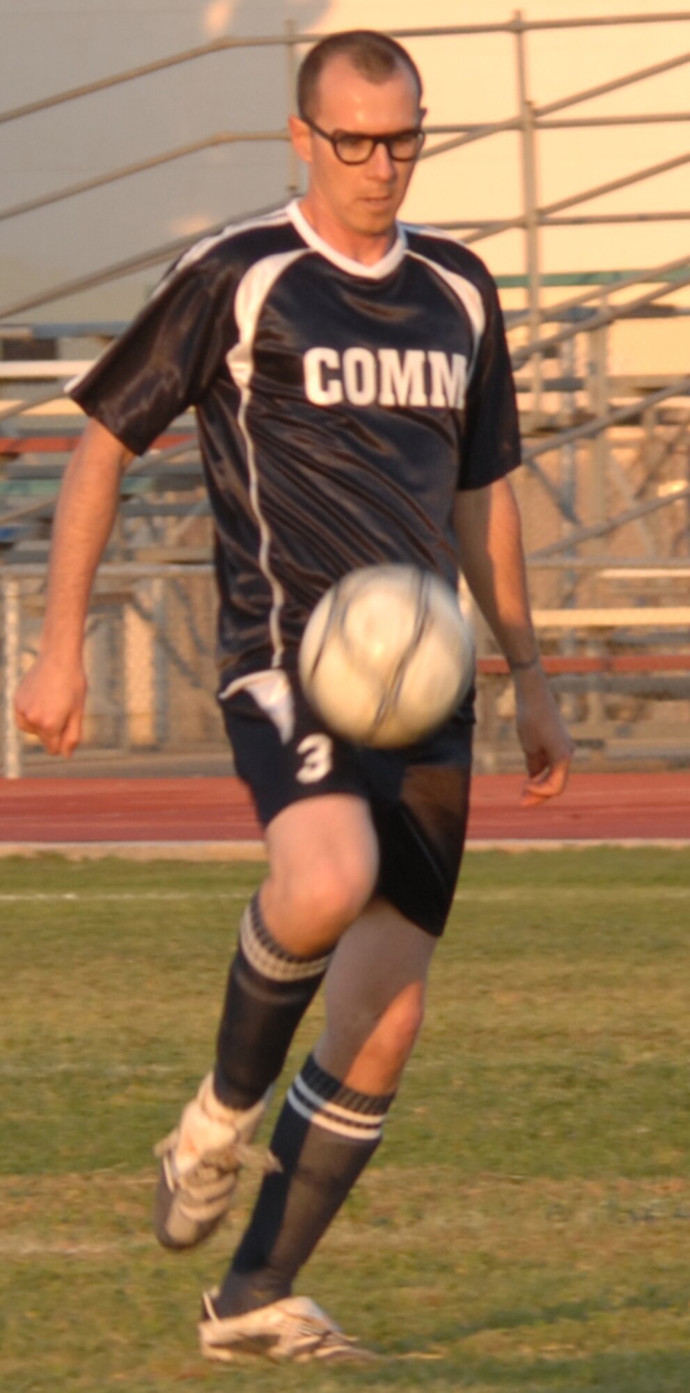 Staff Sgt. Gerald Lenahan, 39th Communication Squadron team, gains control of the ball during an intramural soccer game versus the 39th Maintenance Squadron at Incirlik Air Base, Turkey, April 28, 2009. The game resulted in a tie score of 2-2. The intramurals are made up of nine squadron teams. (U.S. Air Force photo/Staff Sgt. Lauren Padden)