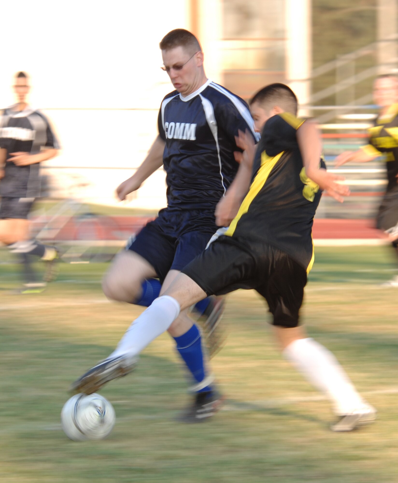 Airman Alan Esqueda, 39th Maintenance Squadron team, tries to steal the ball from SSgt Kristipher Padden, 39th Communications Squadron team during an intramural soccer game at Incirlik Air Base, Turkey, April 28, 2009. The game resulted in a tie score of 2-2. The intramurals are made up of nine squadron teams. (U.S. Air Force photo/Staff Sgt. Lauren Padden)