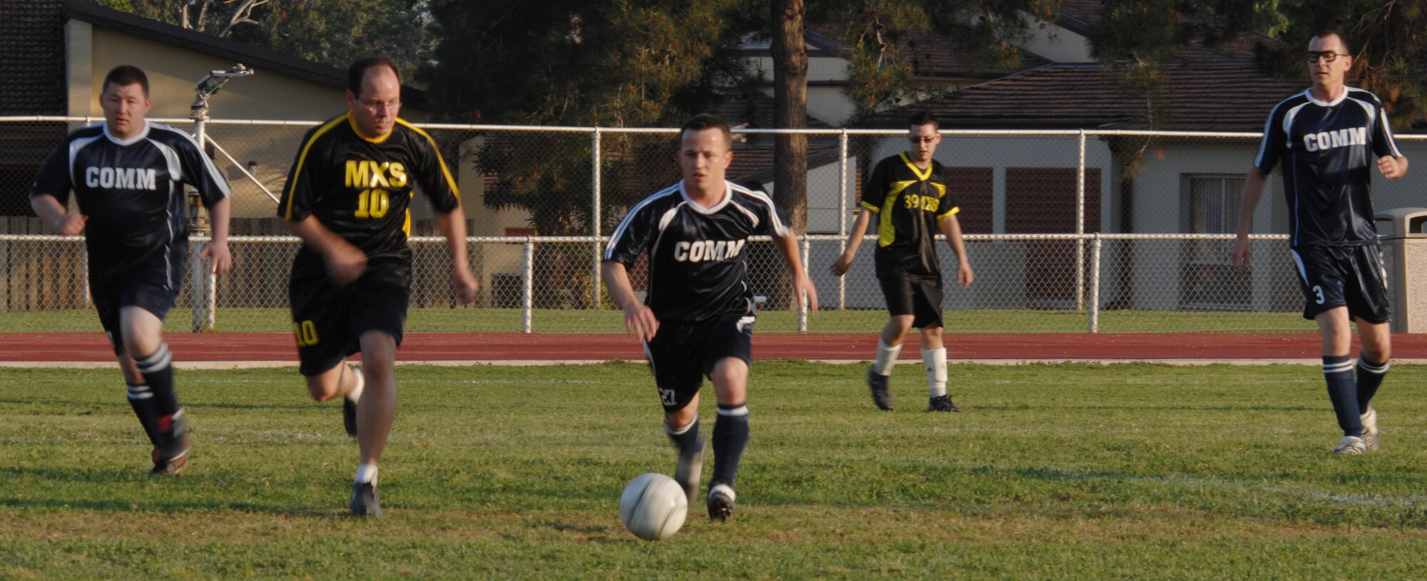 Staff Sgt. Jacob Beck, 39th Communication Squadron team, dribbles the ball down the field during an intramural soccer game versus the 39th Maintenance Squadron at Incirlik Air Base, Turkey, April 28, 2009. The game resulted in a tie score of 2-2. The intramurals are made up of nine squadron teams. (U.S. Air Force photo/Staff Sgt. Lauren Padden)