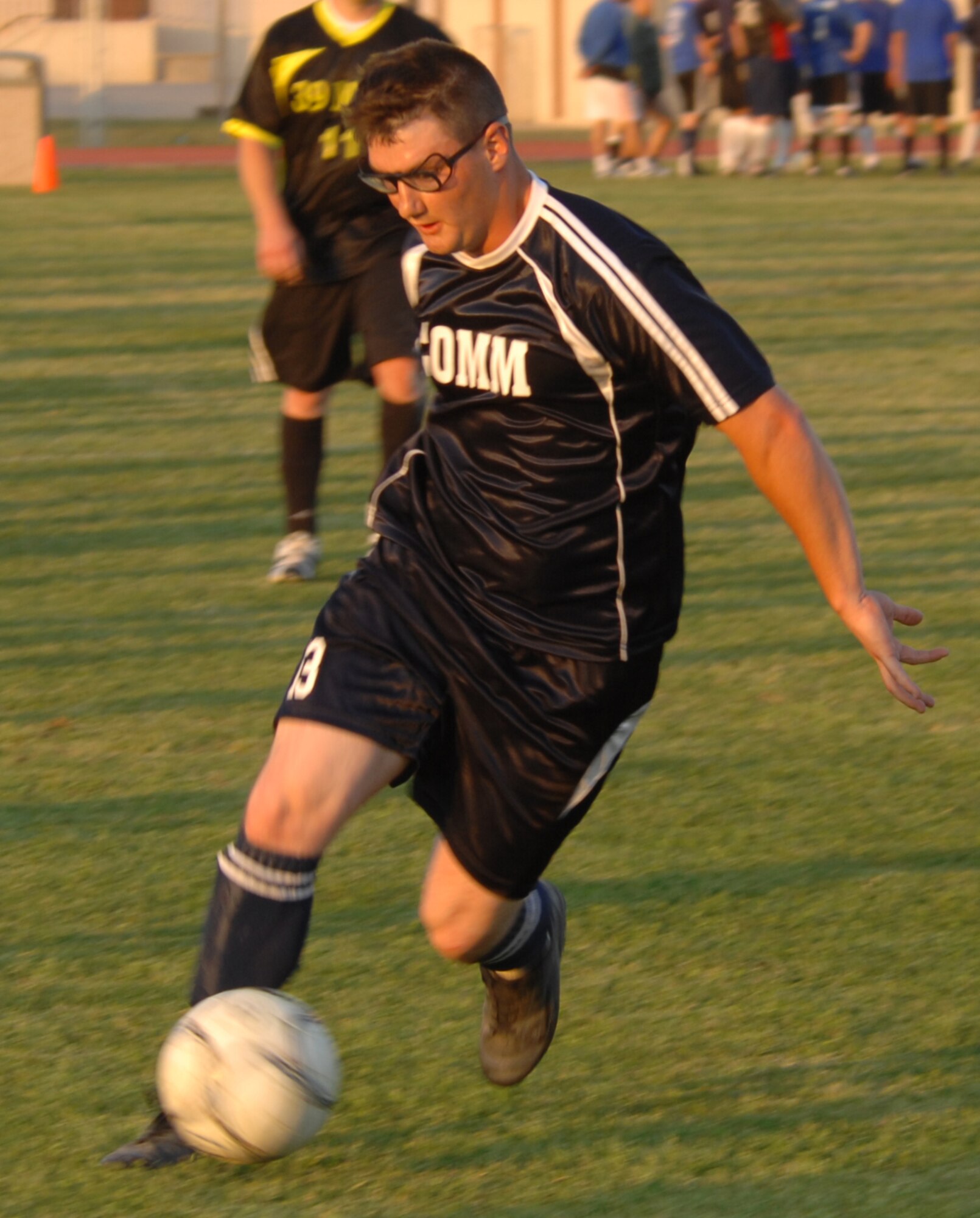 Airman 1st Class Cory Malone, 39th Communication Squadron team, dribbles the ball down the field during an intramural soccer game versus the 39th Maintenance Squadron at Incirlik Air Base, Turkey, April 28, 2009. The game resulted in a tie score of 2-2. The intramurals are made up of nine squadron teams. (U.S. Air Force photo/Staff Sgt. Lauren Padden)