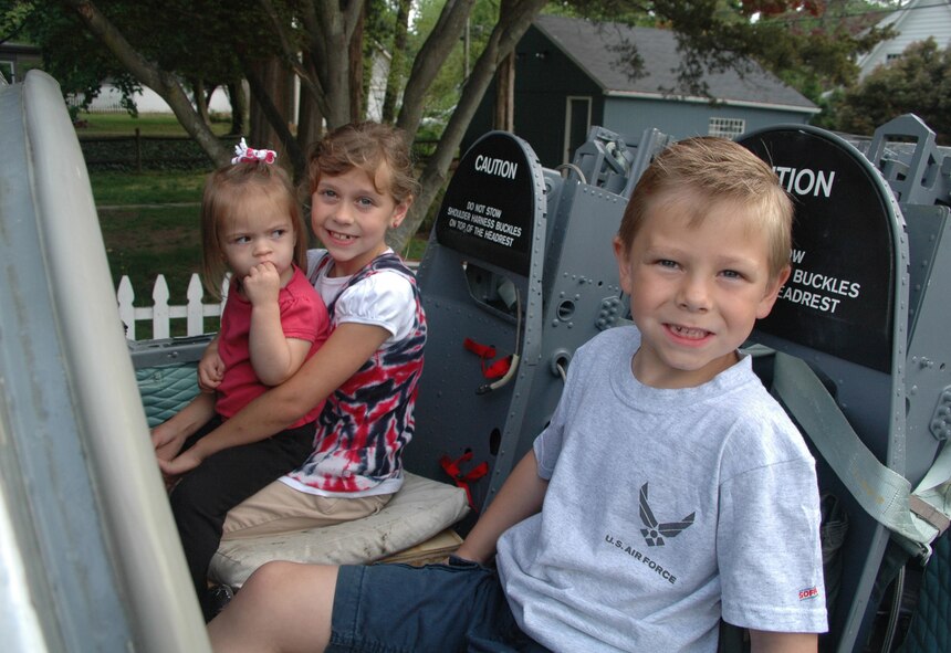 Pictured are Lauren, 1, Hayden, 8, and Garrett, 6, in the 512th Airlift Wing's Liberty Belle T-37 aircraft awaiting the start of the Old Dover Days parade May 2 in historic Dover, Del. They are the children of 512th AW Commander Col. Randal L. Bright and wife Amy. In it's 76th year, Old Dover Days offers a glimpse of the state capital and features a parade, maypole dancing, walking tours, entertainment, art, crafts and food. (U.S. Air Force photo/Capt. Marnee A.C. Losurdo)