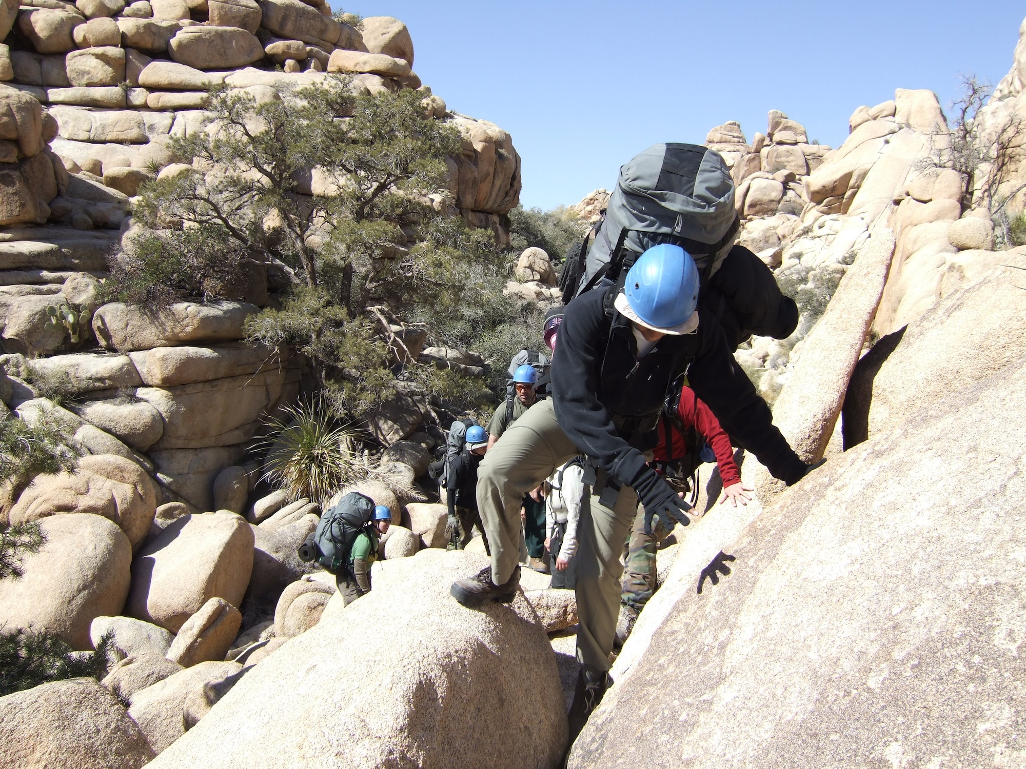 Staff Sgt. Lindsay Howard leads a group negotiating over a relatively small obstacles in the "Wonderland of Rocks" in Joshua Tree National Park during a wilderness-based course run by the non-profit educational organization Outward Bound. US Air Force photo by Tech. Sgt. Robert Galusha