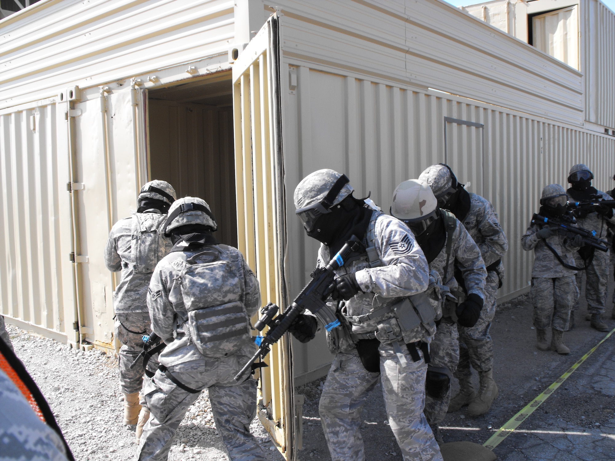 A security forces team prepares to enter and clear a building of hostiles during Patriot Defender Training in Mineral Wells, Texas at Fort Wolters Military Reservation March 13 through March 29, 2009.  (photo courtesy of Master Sgt. John Gasiorek)
