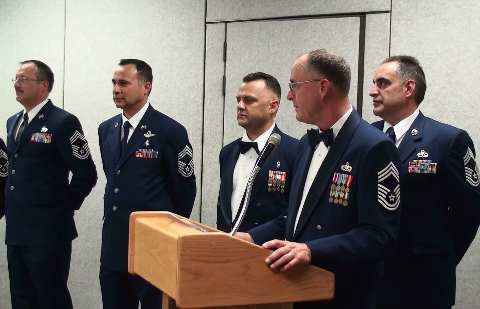 Co-Master of Ceremonies, Chief Master Sgt. Brian K. Wels, (podium) 452nd Aircraft
Maintenance Squadron superintendent, recites the Chief’s Creed as inductee Chief
Master Sgts. (left-right) Robert B. Ehlers, Jr., Juan M. Covarrubias, Daniel A. Avella
and Daniel W. Allee present themselves during the 2009 Chief Induction Ceremony.
(U.S. Air Force photo/Master Sgt. Michael Blair)