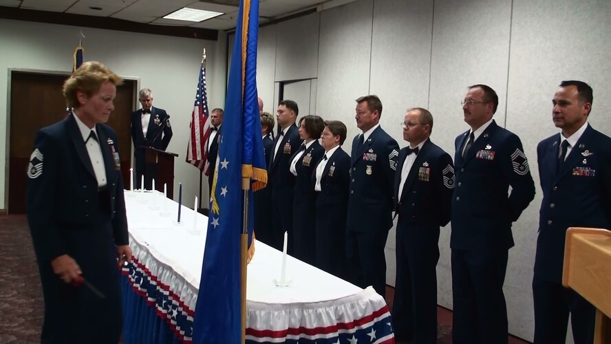 Sixteen Chiefs stand to be recognized during the Chief Master Sergeant Induction Ceremony, April 18, at the Hap Arnold Club. The ceremony welcomes March’s newest chiefs to the highest enlisted grade in the Air Force. (U.S. Air Force photo/Master Sgt. Michael Blair)