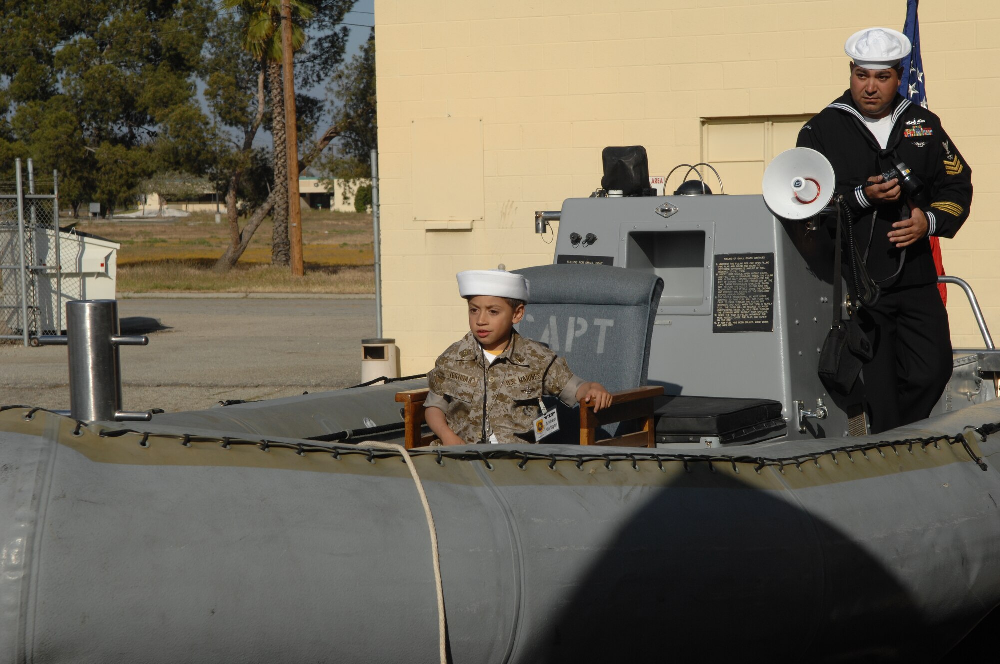 Andrew is at the helm of a Navy Rigid Hull Inflatable Boat (RHIB) at the Navy Operational Support Center-Riverside. (U.S. photos by Staff Sgt. Angel Gallardo)