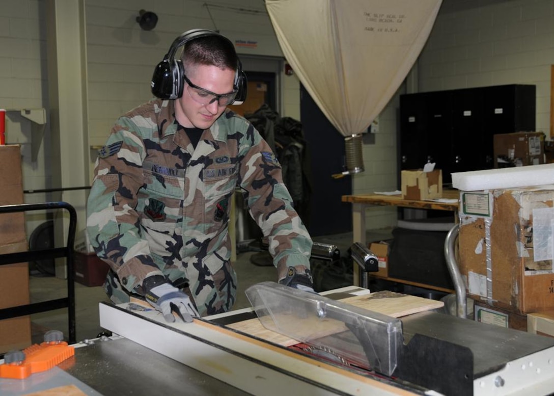 Senior Airman Bermudez cutting plywood for a shipping case.   