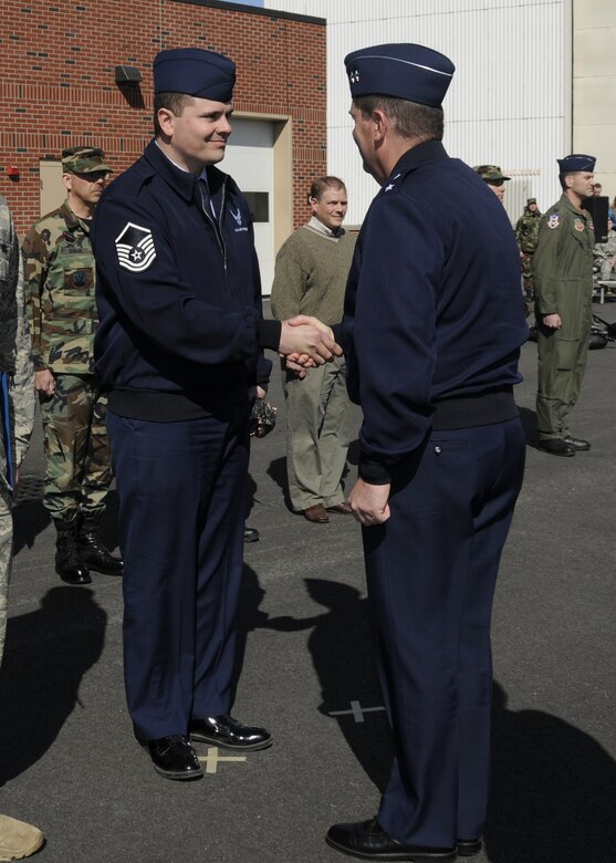 Master Sgt. Ernest Smith is congratulated by Maj Gen Michael Akey for being selected as the Recruiter of the Year.                                                 