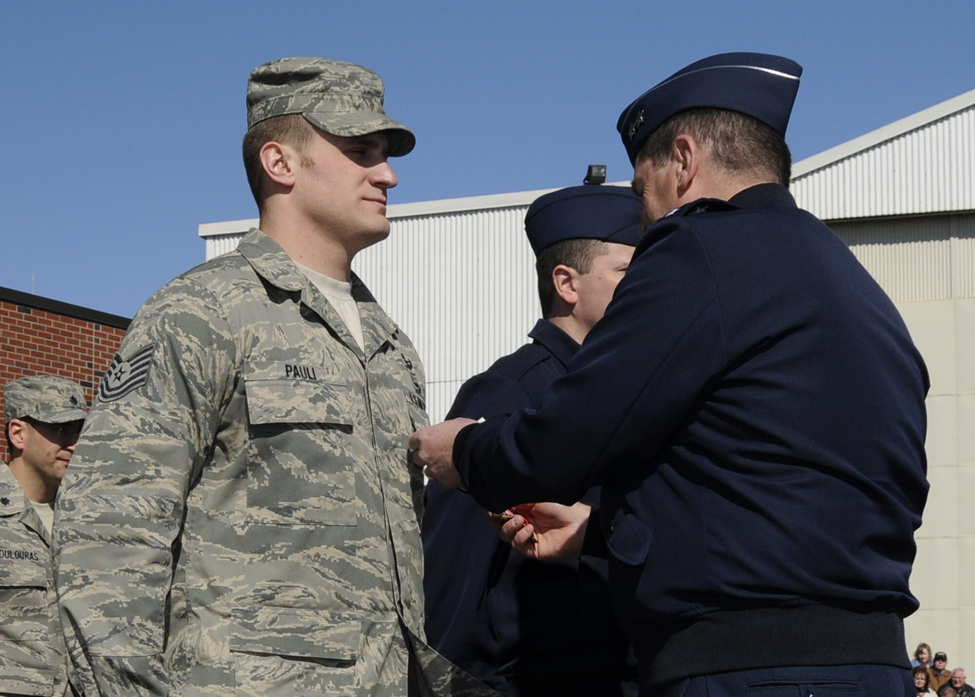 Tech. Sgt. Gregory Pauli receives the Bronze Star with Valor from Gen Michael Akey during the April UTA.                                            