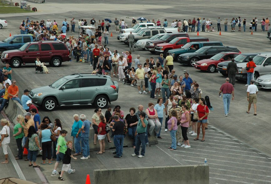 The line to enter the case lot sale extended out from the building and onto the taxiway and parking lot May 2 at Duke Field.  People began lining up early, braved the heat of the day, and long wait to get the deals available from the sale.  U.S. Air Force photo/Staff Sgt. Jon McCallum.