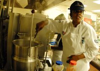 Airman 1st Class Erica Jones, 919th Services Flight, stirs a broth in preparation for the lunch May 3 at the Duke Field dining facility.  The 919th SVF won a Hennessy Award this year for their superior performance at the dining facility.  U.S. Air Force photo/Staff Sgt. Samuel King Jr.